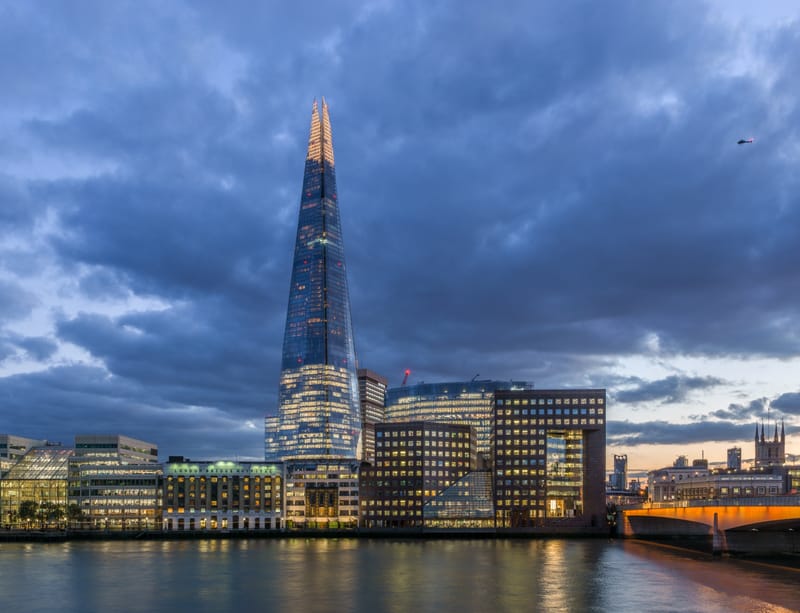 The Shard and London Bridge Hospital at dusk, seen across the Thames.